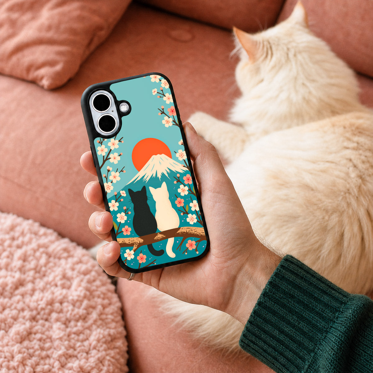 Fuji Cats iPhone 17 case held in hand – lifestyle view